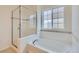 Bathroom featuring tub and shower combo at 1436 Turnberry Dr, Castle Rock, CO 80104