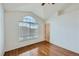 Bedroom featuring wood floors and large window at 1436 Turnberry Dr, Castle Rock, CO 80104