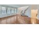 Inviting entryway features hardwood floors, staircase, and ample natural light at 1436 Turnberry Dr, Castle Rock, CO 80104