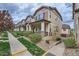 Inviting townhomes with landscaped front yards and charming architectural details at 1436 Turnberry Dr, Castle Rock, CO 80104
