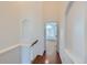 Hallway featuring hardwood floors and access to multiple rooms at 1436 Turnberry Dr, Castle Rock, CO 80104