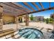 Hot tub with pergola and stone columns is located near the community pool at 1436 Turnberry Dr, Castle Rock, CO 80104