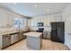 Well-lit kitchen with tile floors, granite countertops, and stainless steel appliances at 1436 Turnberry Dr, Castle Rock, CO 80104