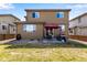 Spacious backyard with a patio area, grill and lush grass, perfect for outdoor living at 17035 E 102Nd Pl, Commerce City, CO 80022