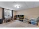 Unfinished carpeted basement with a small window, storage, and a desk at 17035 E 102Nd Pl, Commerce City, CO 80022