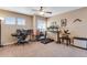 Upstairs bonus room offering lots of sunlight, neutral colors, a ceiling fan, and flexible space at 17035 E 102Nd Pl, Commerce City, CO 80022
