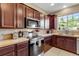 Updated kitchen showcasing stainless steel appliances, ample cabinet space and light countertops at 17035 E 102Nd Pl, Commerce City, CO 80022