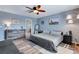 Beautiful main bedroom with ensuite bath, neutral color palette, wood-look floors and lots of natural light at 17035 E 102Nd Pl, Commerce City, CO 80022