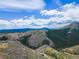 Majestic mountain vista captured from above, highlighting homes dotting the landscape and distant mountain ranges at 718 Emerson Gulch Rd, Boulder, CO 80302