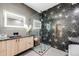 Well-appointed bathroom with a glass-enclosed shower, a modern vanity, and starburst-patterned tile create a spa-like ambiance at 718 Emerson Gulch Rd, Boulder, CO 80302