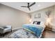 Comfortable bedroom with a blue color scheme, a ceiling fan, and tasteful decor create a relaxing retreat at 718 Emerson Gulch Rd, Boulder, CO 80302