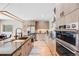 Modern kitchen showcasing sleek cabinets, stainless steel appliances, an island with seating, and hardwood floors at 718 Emerson Gulch Rd, Boulder, CO 80302