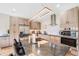 Stylish kitchen featuring stainless steel appliances, stone countertops, modern lighting, and ample cabinet space at 718 Emerson Gulch Rd, Boulder, CO 80302