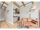 Cozy living room with a kitchenette featuring wood beams and a comfortable sofa for relaxing at 718 Emerson Gulch Rd, Boulder, CO 80302