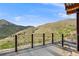 Spacious patio with metal railings overlooking mountain views and a metal tiled floor at 718 Emerson Gulch Rd, Boulder, CO 80302