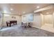 Spacious finished basement with a games table, foosball table, and neutral carpet at 4160 E 115Th Pl, Thornton, CO 80233