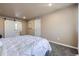 Clean bedroom with sliding closet doors, plush carpet, and neutral color scheme at 4160 E 115Th Pl, Thornton, CO 80233