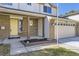 Inviting front porch with yellow door, brick accents and front yard at 4160 E 115Th Pl, Thornton, CO 80233