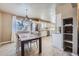 Spacious eat-in kitchen with abundant natural light, updated fixtures, and open layout at 4160 E 115Th Pl, Thornton, CO 80233