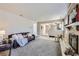 Open-concept living room featuring a fireplace, stylish furniture, and neutral tones at 4160 E 115Th Pl, Thornton, CO 80233