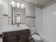 Cozy bathroom featuring modern fixtures, a vanity, and a tiled shower-tub combination at 16605 Peak St, Broomfield, CO 80023