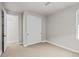 Bedroom with sliding closet doors, plush carpet, and modern lighting at 16605 Peak St, Broomfield, CO 80023