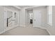 Spacious bedroom with adjacent bathroom, featuring glass doors and ample natural light at 16605 Peak St, Broomfield, CO 80023