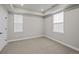 Neutral bedroom with large windows and carpeted floors, ready for personalization and decor at 16605 Peak St, Broomfield, CO 80023