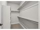 Walk-in closet featuring built in shelving and carpeted floors at 16605 Peak St, Broomfield, CO 80023