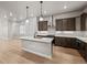 Bright kitchen showcases island with pendant lights, and stainless steel appliances at 16605 Peak St, Broomfield, CO 80023