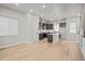 Modern kitchen with dark cabinetry, stainless steel appliances, and an island perfect for entertaining at 16605 Peak St, Broomfield, CO 80023