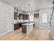 Stylish kitchen featuring pendant lighting, an island sink, and modern appliances at 16605 Peak St, Broomfield, CO 80023
