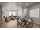 Open living room with lots of natural light, modern decor, fireplace, and hardwood floors at 16605 Peak St, Broomfield, CO 80023