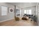 Cozy living room featuring a fireplace, hardwood floors, lots of natural light, and modern decor at 16605 Peak St, Broomfield, CO 80023