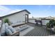 Relaxing rooftop patio with comfortable seating, fire pit, grill, and views at 16605 Peak St, Broomfield, CO 80023