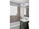 Bathroom with shower and a glass block window at 2970 Leyden St, Denver, CO 80207