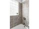 Bathtub with a glass block window above the shower at 2970 Leyden St, Denver, CO 80207