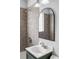 Bathroom sink with a modern mirror at 2970 Leyden St, Denver, CO 80207