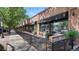 Charming Bistro Vendome with a brick exterior, black awning, and inviting outdoor seating area along the sidewalk at 2970 Leyden St, Denver, CO 80207