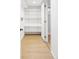 Walk-in closet with ample shelving space, a light-colored floor, and access to storage at 2970 Leyden St, Denver, CO 80207