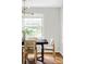 Bright dining room features a large window and hardwood flooring at 2970 Leyden St, Denver, CO 80207