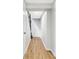 Hallway with hardwood floors and white walls at 2970 Leyden St, Denver, CO 80207