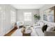 Bright living room featuring hardwood floors and lots of natural light at 2970 Leyden St, Denver, CO 80207
