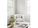 Cozy chair situated near natural light in living room setting at 2970 Leyden St, Denver, CO 80207