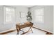 Bright office space with a simple desk and hardwood floors at 2970 Leyden St, Denver, CO 80207