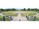 A large open park space with geometric concrete pathways, benches, and landscaped areas for recreation at 2970 Leyden St, Denver, CO 80207