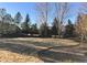 Large backyard with many tall, beautiful trees at 15346 Heritage Cir, Thornton, CO 80602