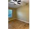 Bright bedroom featuring hardwood floors, neutral walls, and a window offering natural light at 15346 Heritage Cir, Thornton, CO 80602
