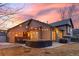 Outdoor living space with patio seating and string lights, perfect for enjoying evenings at 5410 S Vivian St, Littleton, CO 80127