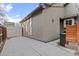 Side yard showcasing the home's siding, fenced area, and outdoor storage options at 5410 S Vivian St, Littleton, CO 80127